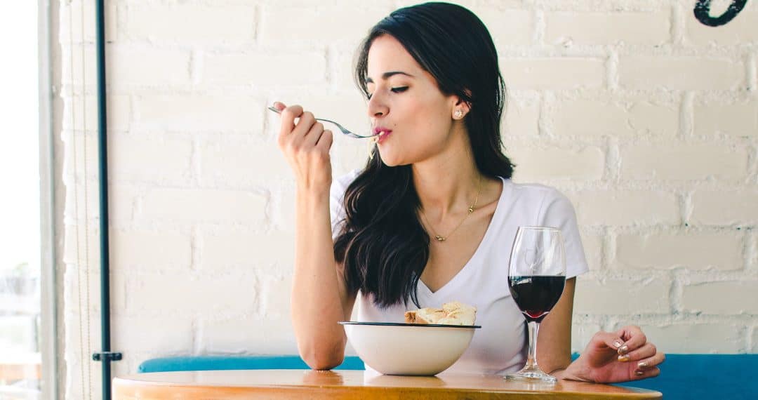 woman eating in a cafe