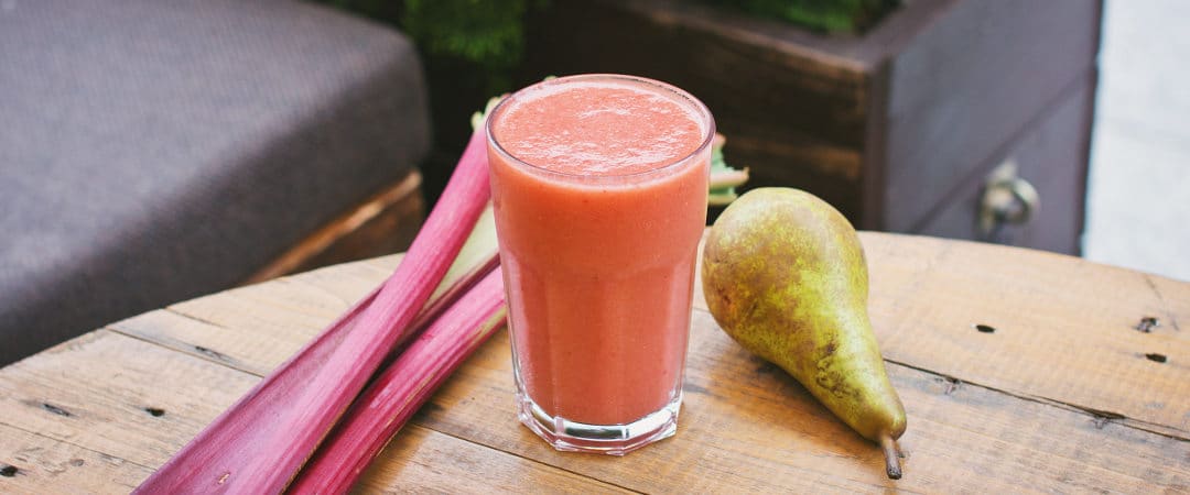 pink smoothie in glass on table