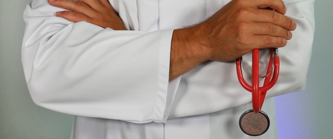 doctor crossing his arms with a stethoscope in his hand