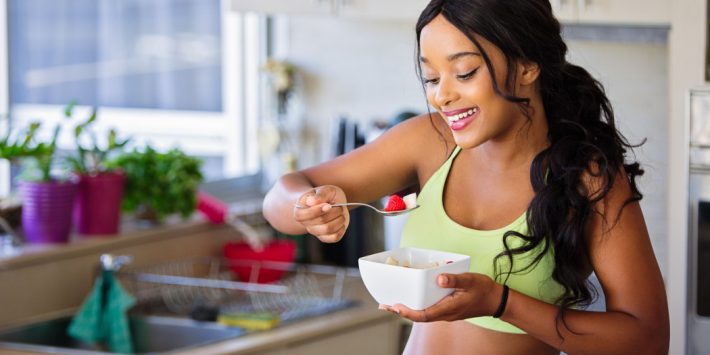 woman eating a healthy pre workout snack