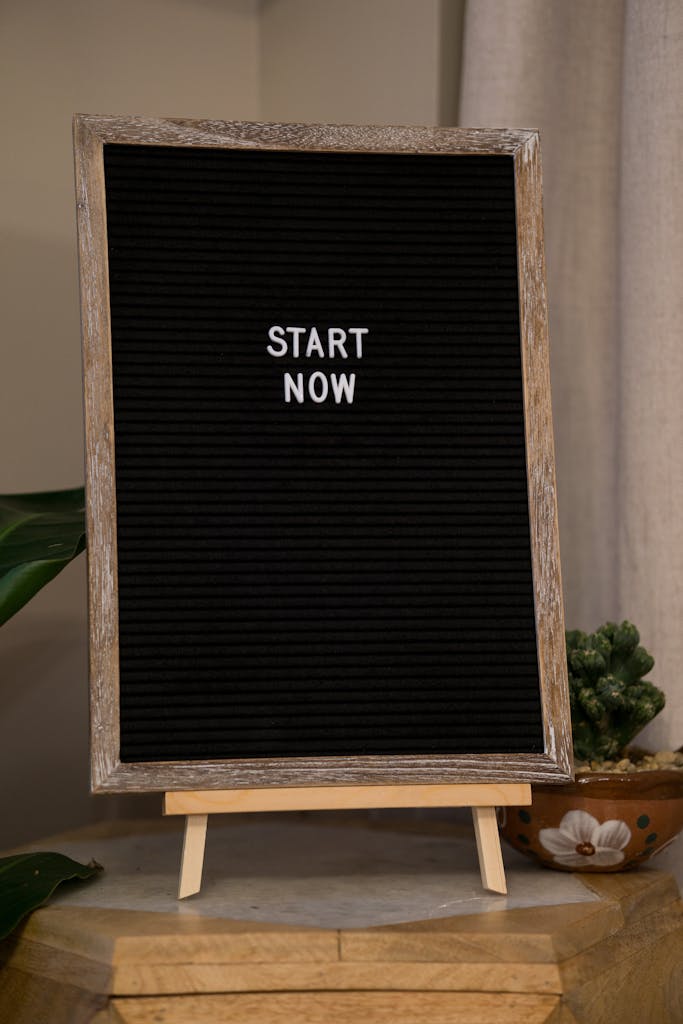 Wooden framed board with 'Start Now' message for motivation and inspiration.